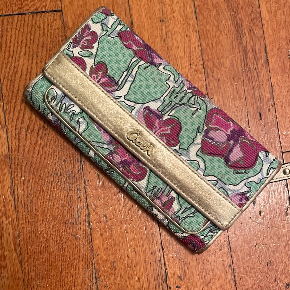 Pink and green floral coach wallet.